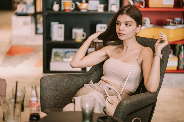 Beautiful Girl Sitting Cafe Mall While Holding Her Hair — Stock Photo, Image