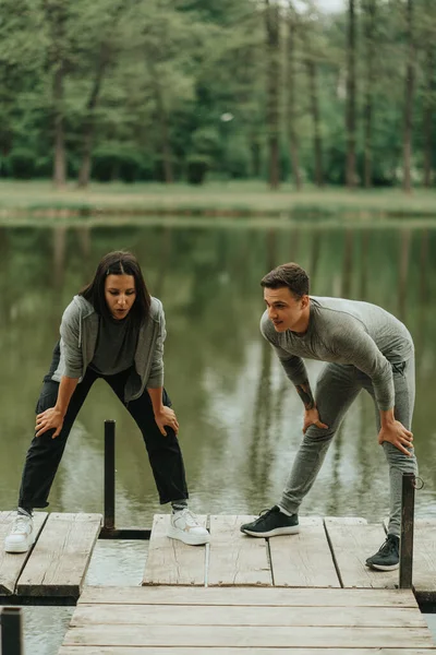 Strong Couple Taking Breath Work Out Park — 스톡 사진