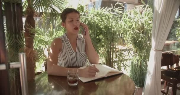 Business Woman Working Terrace Cafe Bar Daytime Writing Something Her — Stockvideo