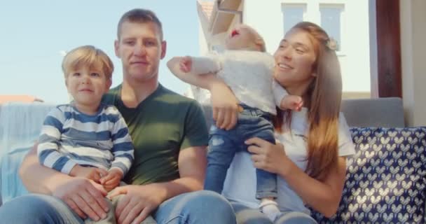 Caring Adorable Family Sitting Together While Playing Kid Who Crying — Stock video