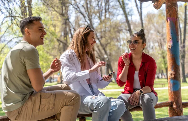 Portrait Cheerful Young Man Sitting Park His Friends — Photo