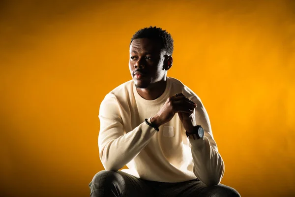 Young Black Male Posing Yellow Background Sitting Chair — 图库照片