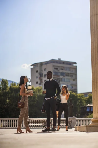 Two Multiracial Business Partners Talking Company While Third Partner Talking — Fotografia de Stock