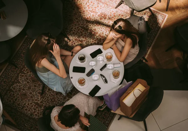 Three Teenage Pretty Girls Talking Cafe While Sitting —  Fotos de Stock