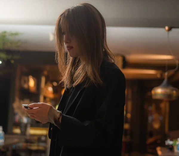 Attractive Adorable Girl Checking Her Phone While Standing — Fotografia de Stock