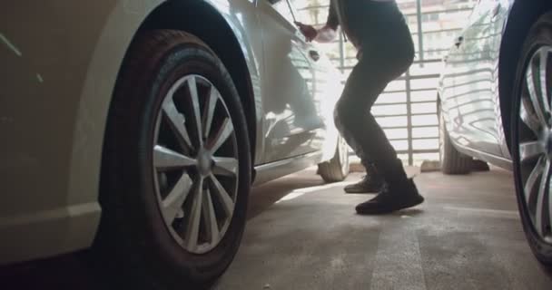 Thief Unlocking Car Public Garage Entering — Stock Video