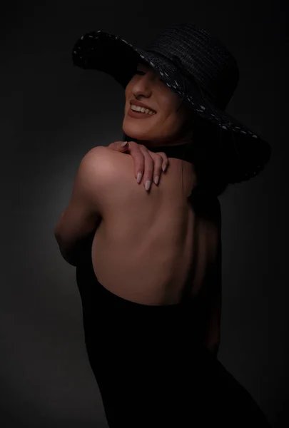 Attractive Girl Dressed Black Dress Hat Smiling Studio — Stock Photo, Image