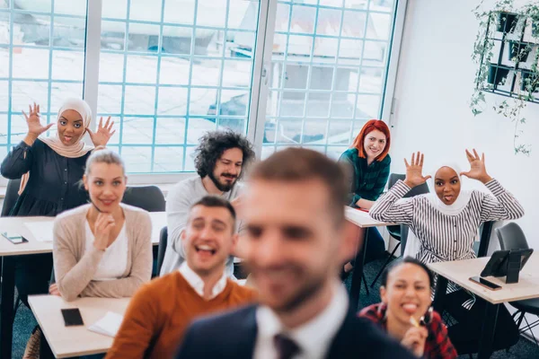 Young diverse team of people laughing and having fun in a training session