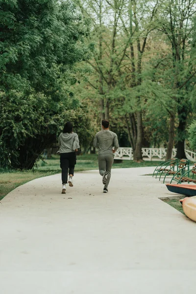 Strong Couple Running Middle Road Park — Foto de Stock