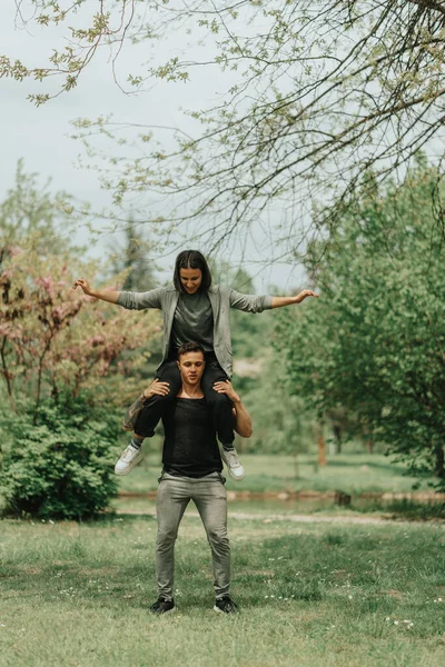 Handsome Boy Holding His Girlfriend His Back While Standing Grass — Stock Photo, Image