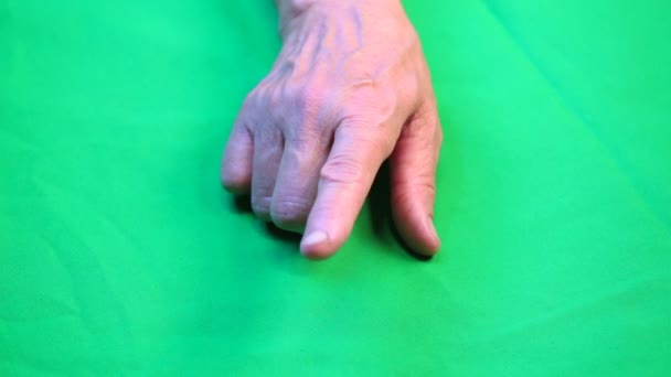 Hand points on green background — Stock Video