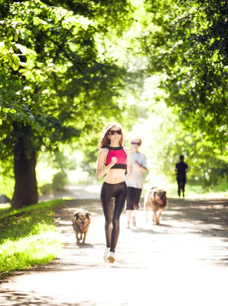 Sports girl runs in park effect films — Stock Photo, Image