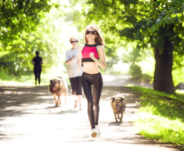 Sports girl runs in park effect films — Stock Photo, Image