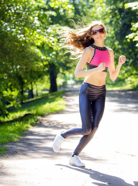 Sports girl runs in park effect films — Stock Photo, Image