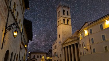 Night view of the main square of Assisi at christmas time in Umbria Italy