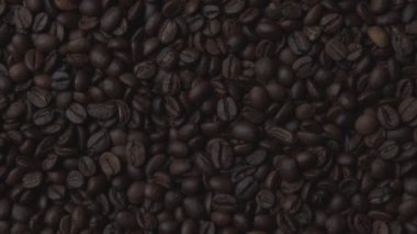 Roasted coffee beans in rotation. Macro shot