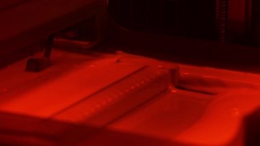 The process of creating a model on a 3D printer. Printing on a 3D printer.