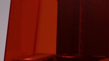 The process of creating a model on a 3D printer. Printing on a 3D printer.