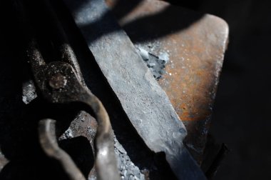 Almaty, Kazakhstan - 09.24.2015 : Various blacksmith's tools on a wooden stand in the workshop