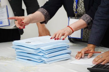 Almaty, Kazakhstan - 06.05.2022 : Counting of votes after the closing of the polling station. 