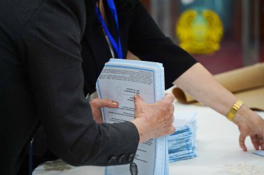 Almaty, Kazakhstan - 06.05.2022 : Counting of votes after the closing of the polling station. 