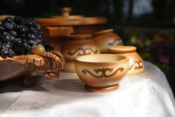 Wooden carved tableware with Kazakh national pattern