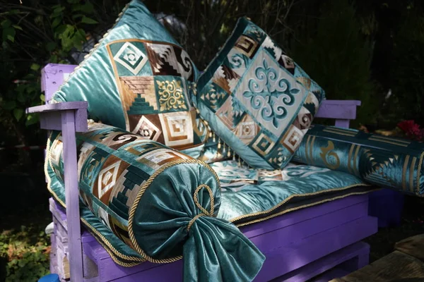 Pillows and bedspread in the Kazakh national style with a pattern.