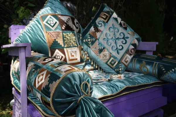 Pillows and bedspread in the Kazakh national style with a pattern.