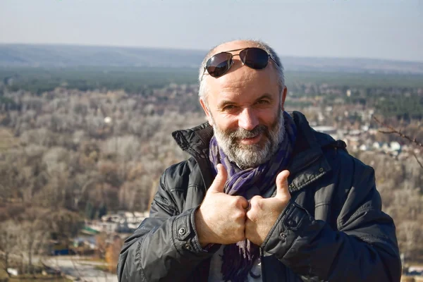 Portrait of a mature man showing two thumbs — Stock Photo, Image