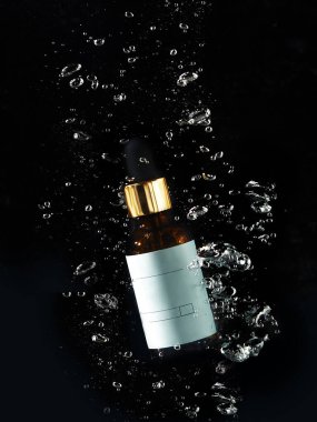 jar in water with bubbles on black background