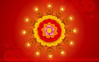 Diwali diya çiçek rangoli üzerine dekore edilmiştir