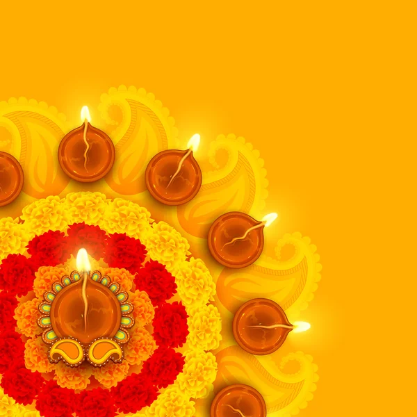 Inredda diwali diya på blomma rangoli — Stock vektor