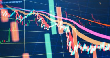 Borsa ve fintech kavramı. Monitörde soyut finansal ticaret grafikleri.