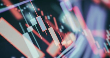 Bilgisayar ekranında finansal grafikler, öncü ekranda borsa grafiği. Finans ve yatırım konsepti. Seçici odak.