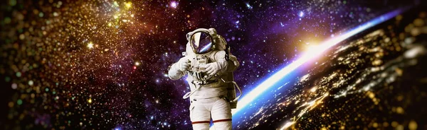 Picture of astronaut spacewalking with glowing stars . Astronaut in outer space. Elements of this image furnished by NASA.