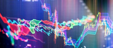 Finance and investment concept. Charts of financial instruments with various type of indicators including volume analysis for professional technical analysis on the monitor of a computer.