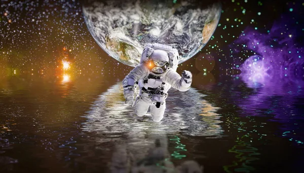 Picture of astronaut spacewalking with glowing stars . Astronaut in outer space. Elements of this image furnished by NASA.