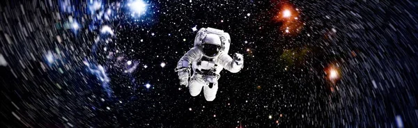 Astronaut in outer space.Cosmic art, science fiction wallpaper. Beauty of deep space. Elements of this image furnished by NASA