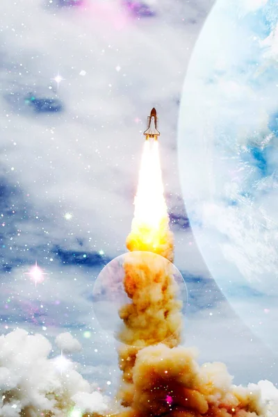 Space shuttle rockets launch into space on the starry sky. spacecraft flies into space with clouds of smoke.  Elements of this image furnished by NASASpace shuttle rockets launch into space on the starry sky. spacecraft flies into space with clouds o