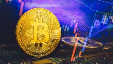 Cryptocurrency concept , Golden bitcoin on mainboard , The future of money. Computational equipment.