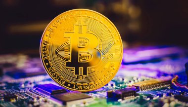 Blockchain technology bitcoin mining concept. Bitcoin golden coin on computer circuit board. banner copy space