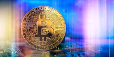 Cryptocurrency concept , Golden bitcoin on mainboard , The future of money. Computational equipment.
