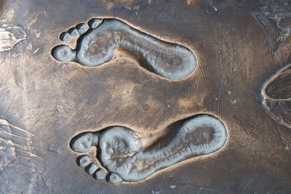 Traces of the person on bronze — Stock Photo, Image