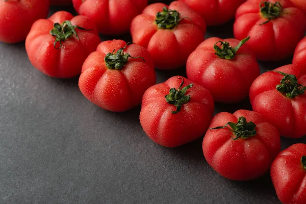 Fresh red tomatoes on a grey background — Stock Photo, Image