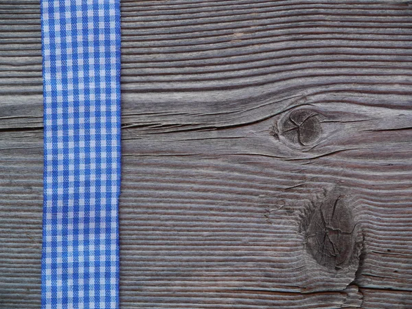Дерев'яний фон з перевіреною стрічкою Ліцензійні Стокові Зображення