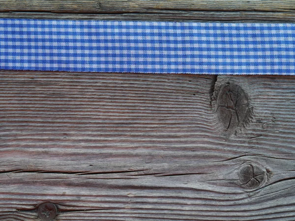 チェック リボンと木製の背景 ストック写真
