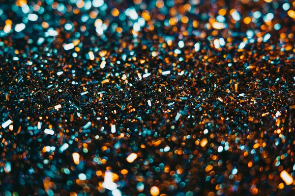 Festlicher Glitzerhintergrund. Buntes blaues und orangefarbenes Licht. Kopierraum für Kunst-Party-Projekt. Abstraktes funkelt glänzend, schöne Textur — Stockfoto