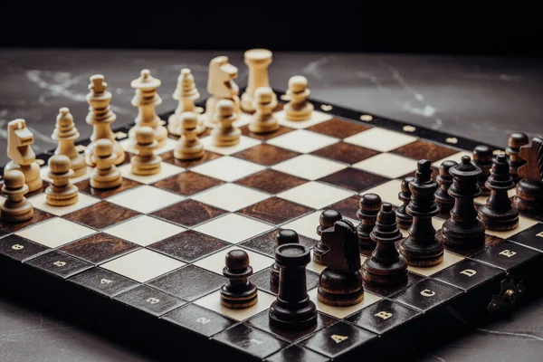 Old vintage chess pieces on wooden chessboard. Board strategy game. Teamwork, success business, intelligence sport concept. — Stock fotografie