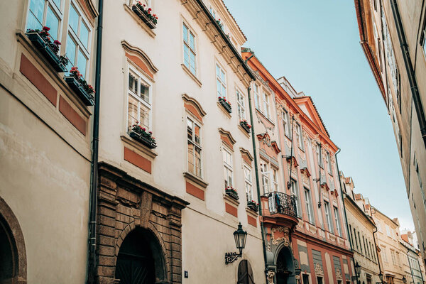 Beautiful cozy narrow street in old town of Prague. Amazing european facades, architecture, historical facades of traditional buildings. High quality photo