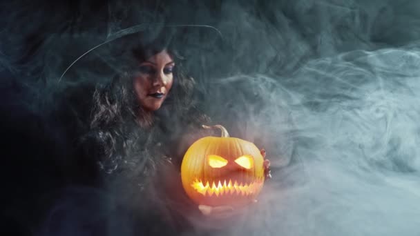 Mysterious Black Witch Steaming Pumpkin Head Jack Lantern Dark Backdrop — Stock Video